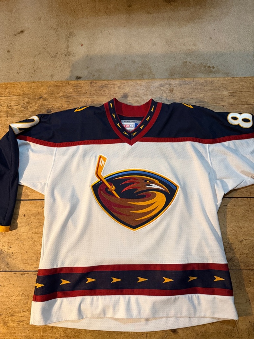 CCM White Navy Red Gold Hockey Jersey Sleeve Detail